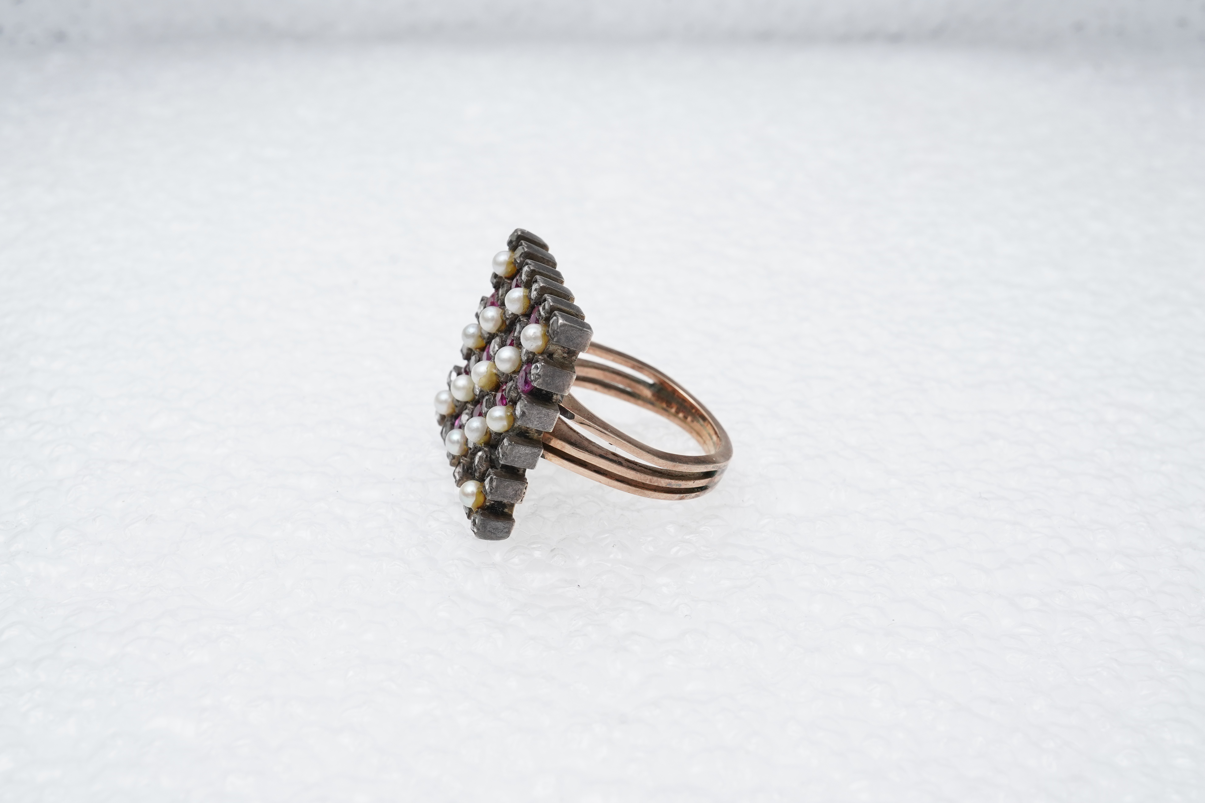 A synthetic ruby, seed pearl and diamond ring